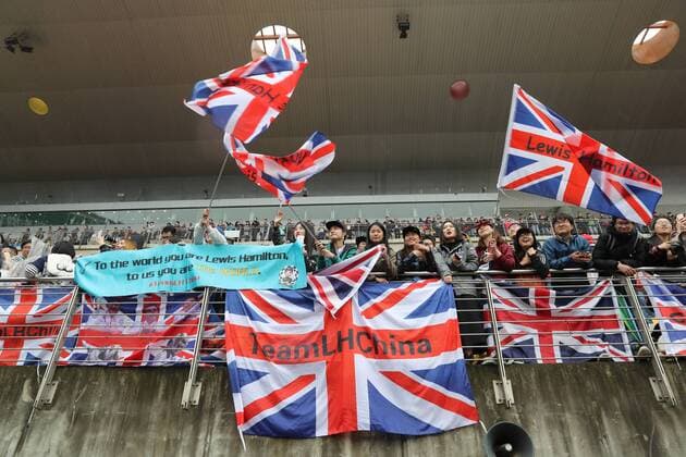 Fans of British F1 driver Lewis Hamilton of Mercedes wave British flags to show their support at the Shanghai International Circuit in Shanghai, China, 7 April 2017. Lewis Hamilton fascinates fans with gifts in Shanghai  20170407_08260