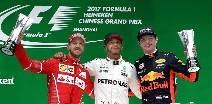 (170409) -- SHANGHAI, April 9, 2017 -- Mercedes driver Lewis Hamilton (C)of Britain, Ferrari driver Sebastian Vettel(L) of Germany and Red Bull Racing driver Max Verstappen of the Netherlands celebrate on the podium after the Formula One Chinese Grand Prix at the Shanghai International Circuit in Shanghai, east China, April 9, 2017. ) (SP)CHINA-SHANGHAI-F1-2017 CHINESE GRAND PRIX(CN) fanxjun 