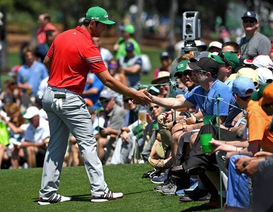 April 9, 2017 - Augusta, GA, USA - Jon Rahm, left, shakes hands with the fan he hit with his ball along the second green during the final round of the Masters Tournament on Sunday, April 9, 2017 at Augusta National Golf Club in Augusta, Ga. 2017 Masters Round 4 - ZUMAm67_ 20170409_zaf_m67_045 Copyright: xJeffxSinerx