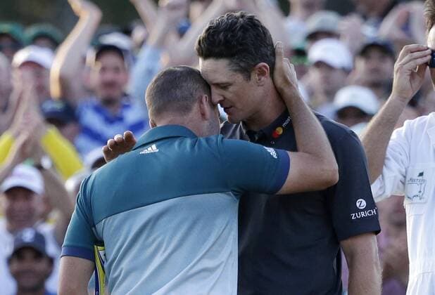 Sergio Garcia of Spain and Justin Rose of England embrace on the 18th green after Garcia wins the 2017 Masters Tournament at Augusta National Golf Club in Augusta, Georgia on April 9, 2017. Garcia defeated Justin Rose of England in a one hole playoff to win his first major championship.  AUG20170409623 JOHNxANGELILLO