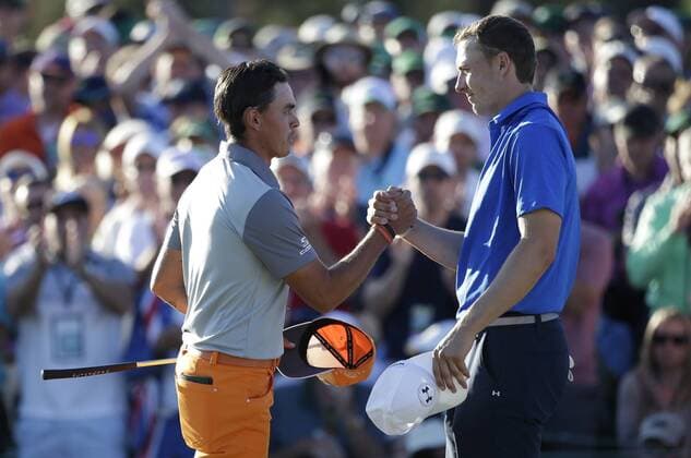 Jordan Spieth and Rickie Fowler shake hands on the 18th green in the final round of the 2017 Masters Tournament at Augusta National Golf Club in Augusta, Georgia on April 9, 2017. Sergio Garcia of Spain defeated Justin Rose of England in a one hole playoff to win his first major championship.  AUG20170409629 JOHNxANGELILLO