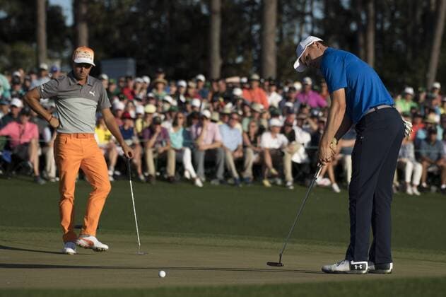 Jordan Spieth and Rickie Fowler putt on the 18th green during the 2017 Masters Tournament at Augusta National Golf Club in Augusta, Georgia on April 9, 2017. Sergio Garcia won the 2017 Masters.  AUG20170409344 KEVINxDIETSCH
