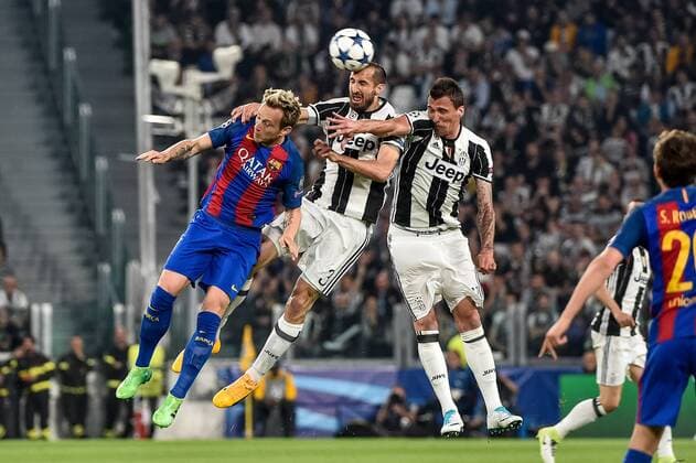 Ivan Rakitic of Barcelona Giorgio Chiellini of Juventus and Mario Mandzukic of Juventus during the UEFA Champions League quarter final match between Juventus and Barcelona at the Juventus Stadium, Turin, Italy on 11 April 2017. Copyright: xGiuseppexMaffiax 14920073