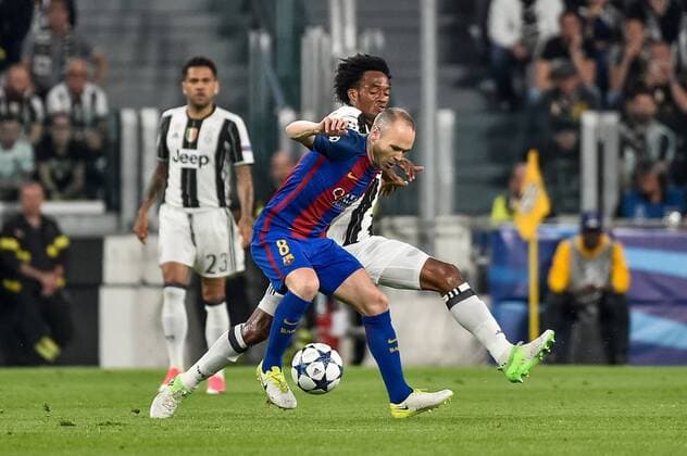 Andres Iniesta of Barcelona and Juan Cuadrado of Juventus during the UEFA Champions League quarter final match between Juventus and Barcelona at the Juventus Stadium, Turin, Italy on 11 April 2017. Copyright: xGiuseppexMaffiax 14920076