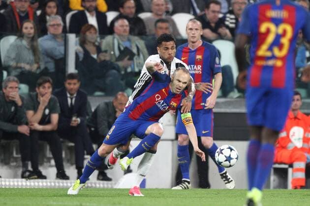 April 11, 2017 - Turin, Italy - Barcelona midfielder Andres Iniesta (8) fights for the ball against Juventus defender Dani Alves (23) during the Uefa Champions League quarter finals football match JUVENTUS - BARCELONA on 11 04 2017 at the Juventus Stadium in Turin, Italy. Juventus v FC Barcelona Barca - UEFA Champions League Quarter Final: First Leg  - ZUMAn230 20170411_zaa_n230_227 Copyright: xMatteoxBottanellix