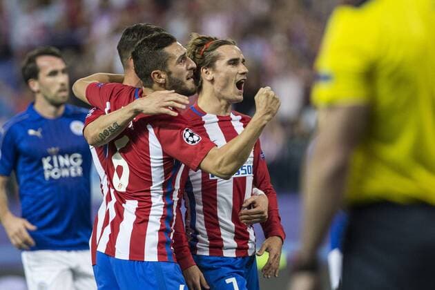 Antoine Griezmann, Fernando Torres and Koke Resurrecccion of Atletico de Madrid celebrates after scoring a goal during the match of Champions LEague between Atletico de Madrid and LEicester City Football Club at Vicente Calderon Stadium in Madrid, Spain. April 12, 2017.  (20170412032)