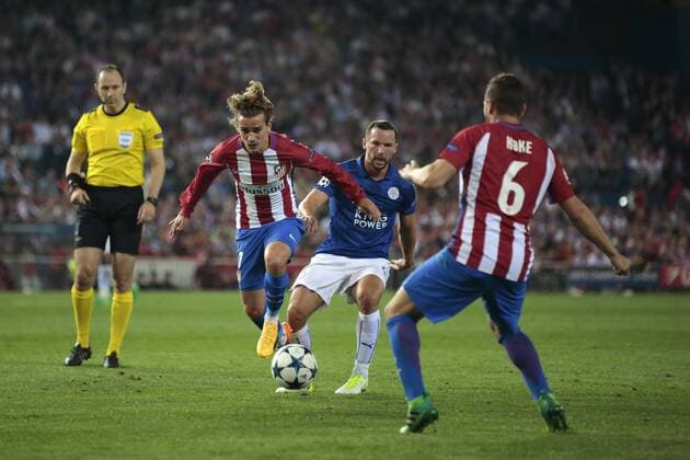 April 12th 2017, Madrid, Spain; UEFA Champions League football quarterfinal, leg 1, Atletico Madrid versus leicester City; Antoine Griezmann passes the ball to Koke of Atletico de Madrid as Danny Drinkwater challenges xSantiagoxVidalx  ActionPlus11866945