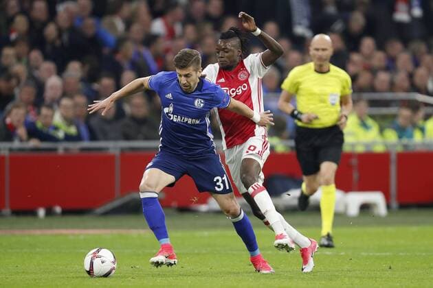 (L-R) Matija Nastasic of FC Schalke 04, Bertrand Traore of Ajaxduring the UEFA Europa League quarter final match between Ajax Amsterdam and FC Schalke 04 at the Amsterdam Arena on April 13, 2017 in Amsterdam, The Netherlands Ajax v FC Schalke 04 UEFA Europa League 2016 2017 xVIxxIVx 7562662