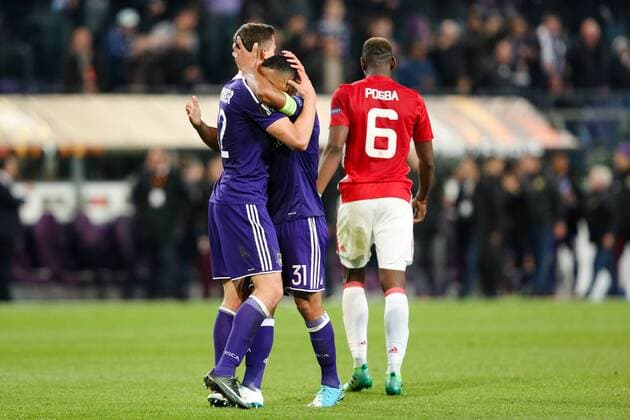 Manchester United ManU s Paul Pogba walks off dejected as Anderlecht?s Youri Tielemans and Anderlecht?s Leander Dendoncker celebrate during the Europa League Quarter Final 1st leg match at RSCA Constant Vanden Stock Stadium, Anderlecht, Belgium. Picture date: April 13th, 2017.Pic credit should read: Charlie Forgham-Bailey Sportimage EDITORIAL USE ONLY. No use with unauthorised audio, video, data, fixture lists, club league logos or live services. Online in-match use limited to 120 images, no video emulation. No use in betting, games or single club league player publications.