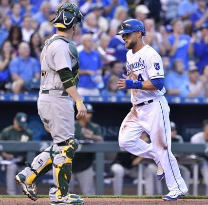 April 13, 2017 - Kansas City, MO, USA - The Kansas City Royals Alex Gordon, right, scores in front of Oakland Athletics catcher Stephen Vogt on a single by Lorenzo Cain in the first inning at Kauffman Stadium in Kansas City, Mo., on Thursday, April 13, 2017. Oakland at Kansas City - ZUMAm67_ 20170413_zaf_m67_037 Copyright: xJohnxSleezerx