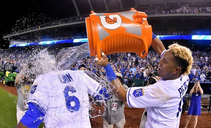 April 13, 2017 - Kansas City, MO, USA - The Kansas City Royals Salvador Perez douses Lorenzo Cain (6) after the team s 3-1 win against the Oakland Athletics at Kauffman Stadium in Kansas City, Mo., on Thursday, April 13, 2017. Oakland at Kansas City - ZUMAm67_ 20170413_zaf_m67_065 Copyright: xJohnxSleezerx