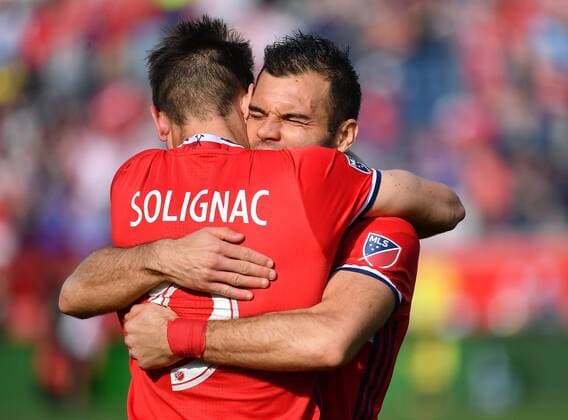 CHICAGO, IL - APRIL 15: Chicago Fire forward Nemanja Nikolic (23) hugs Chicago Fire forward Luis Solignac (9) after scoring a goal during a game between the Chicago Fire and New England Revolution on April 15, 2017, at Toyota Park in Chicago, Illinois. (Photo by Quinn Harris Icon Sportswire) SOCCER: APR 15 MLS Fussball Herren USA - NE Revolution at Chicago Fire Icon174150020 EDITORIAL USE ONLY