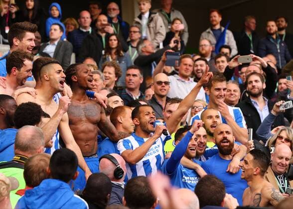 April 17th 2017, Brighton, Sussex, England; Skybet Championship football, Brighton and Hove Albion versus Wigan Athletic; Liam Rosenior of Brighton sings on the microphone as he celebrates with team mates at full time xMarkxKertonx  ActionPlus11869256