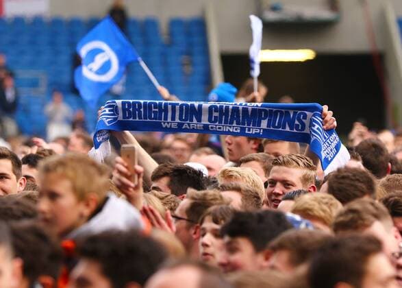 April 17th 2017, Brighton, Sussex, England; Skybet Championship football, Brighton and Hove Albion versus Wigan Athletic; A Brighton fan holds his scarf up as celebrations take place at full time xMarkxKertonx  ActionPlus11869264