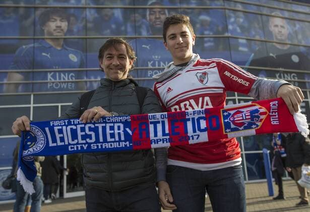 April 18th 2017, Leicester, England, UEFA Champions League football quarter-final, Leicester City versus Atletico Madrid; Two Atletico Madrid supporters holding their team scarves outside the King Power Stadium before the match xRolandxHarrisonx  ActionPlus11869556