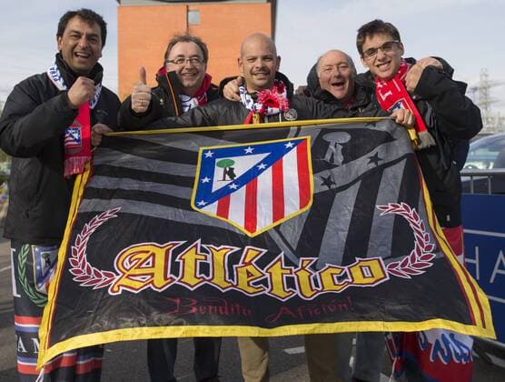 April 18th 2017, Leicester, England, UEFA Champions League football quarter-final, Leicester City versus Atletico Madrid; A group of Atletico Madrid supporters holding the team flag outside the King Power Stadium before the match xRolandxHarrisonx  ActionPlus11869558