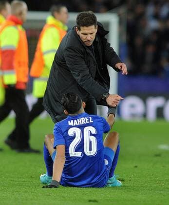 Football - 2016 2017 UEFA Champions League - Quarter-Final, Second Leg: Leicester City vs. Atletico Madrid Atletico Madrid Manager Diego Simeone consoles Riyad Mahrez at the final whistle at the King Power Stadium. COLORSPORT ANDREW COWIE 