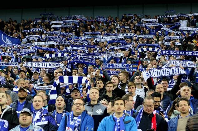 Fans vom FC Schalke 04 in der Nordkurve halten Fan-Schals mit der Aufschrift Eurofighter hoch beim Europa League Viertelfinal Rückspiel (Saison 2016 17) FC Schalke 04 - Ajax Amsterdam Copyright: Thomas Pakusch