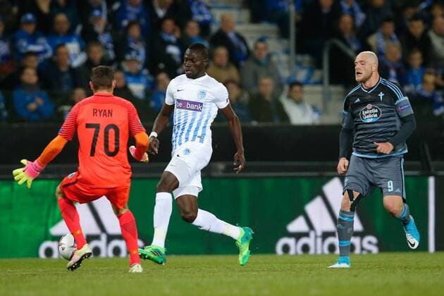 Genk s goalkeeper Mathew Ryan, Genk s Omar Colley and Celta s John Guidetti fight for the ball during the return leg of quarterfinals in the Europa League competition between Belgian soccer team RC Genk and Spanish team Celta Vigo, Thursday 20 April 2017, in Genk. First leg ended on a 2-3 result in Spain. BRUNOxFAHY  x05084134x