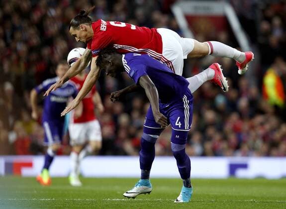 Zlatan Ibrahimovic of Manchester United ManU collides with Serigne Modou Kara Mbodji during the UEFA Europa League Quarter Final 2nd Leg match at Old Trafford, Manchester. Picture date: April 20th, 2017. Pic credit should read: Matt McNulty Sportimage EDITORIAL USE ONLY. No use with unauthorised audio, video, data, fixture lists, club league logos or live services. Online in-match use limited to 120 images, no video emulation. No use in betting, games or single club league player publications.