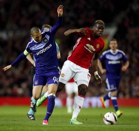 Paul Pogba of Manchester United ManU and Sofiane Hanni of Anderlecht during the UEFA Europa League Quarter Final 2nd Leg match at Old Trafford, Manchester. Picture date: April 20th, 2017. Pic credit should read: Matt McNulty Sportimage EDITORIAL USE ONLY. No use with unauthorised audio, video, data, fixture lists, club league logos or live services. Online in-match use limited to 120 images, no video emulation. No use in betting, games or single club league player publications.