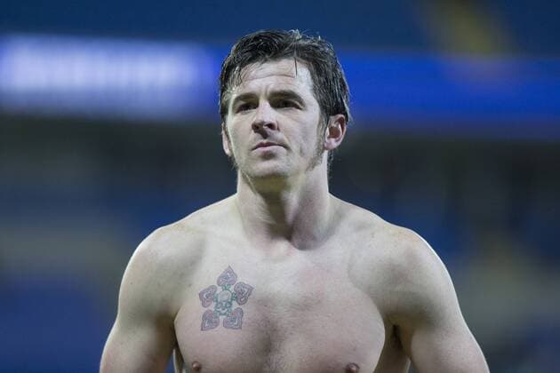 A shirtless Joey Barton of Burnley prepares to give his shirt to a fan at the end of the Sky Bet Championship match between Cardiff City and Burnley at the Cardiff City Stadium, Cardiff, Wales on 28 November 2015. Copyright: xMarkxHawkinsx 07040058