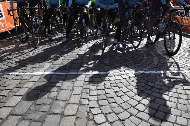 Astana riders pictured at a silence minute in tribute to Italian cyclist Michele Scarpioni who died after a road accident during a training session on his bike yesterday in Italy, ahead of the start of the 102nd edition of the Liege-Bastogne-Liege one day cycling race, 256km with departure and arrival in Liege, Sunday 23 April 2017. DIRKxWAEM  x05085677x