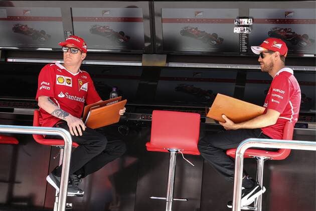 Bilder des Tages - SPORT SOCHI, RUSSIA - APRIL 27, 2017: Scuderia Ferrari F1 team drivers Kimi Raikkonen (L) of Finland and Sebastian Vettel of Germany seen ahead of a free practice session of the 2017 Formula One Russian Grand Prix at the Sochi Autodrom racing circuit. Vyacheslav Prokofyev TASS  TS049CD7