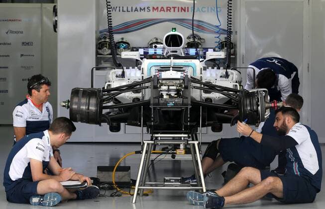 SOCHI, RUSSIA - APRIL 27, 2017: Williams Martini Racing F1 team mechanics prepare a racing car at the Sochi Autodrom racing circuit ahead of the 2017 Formula One Russian Grand Prix. Alexander Demianchuk TASS  TS049CBF