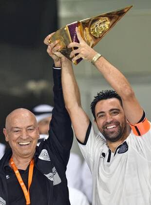 (170430) -- DOHA, April 30, 2017 -- Xavi Hernandez(R), captain of Al Sadd holds the trophy with head coach Manuel Jesualdo Ferrira after winning Qatar Cup football final against El Jaish at the Al Sadd Stadium in Doha, capital of Qatar on April 29, 2017. Al Sadd claimed the title with 2-1. )(wll) (SP)QATAR-DOHA-SOCCER-QATAR CUP-FINAL Nikku 