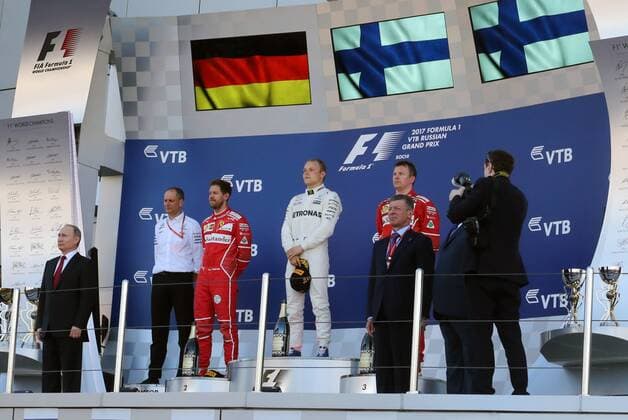 SOCHI, RUSSIA - APRIL 30, 2017: Russia s President Vladimir Putin, second-placed Scuderia Ferrari F1 driver Sebastian Vettel of Germany, first-placed Mercedes AMG Petronas F1 driver Valtteri Bottas of Finland, third-placed Scuderia Ferrari F1 Team driver Kimi Raikkonen of Finland, Russia s Deputy Prime Minister Dmitry Kozak (L-R) at an awards ceremony for the 2017 Formula One Russian Grand Prix at the Sochi Autodrom racing circuit. Mikhail Metzel TASS  TS04A38D