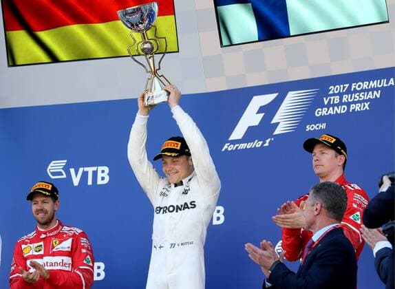 SOCHI, RUSSIA - APRIL 30, 2017: Second-placed Scuderia Ferrari F1 driver Sebastian Vettel of Germany, first-placed Mercedes AMG Petronas F1 driver Valtteri Bottas of Finland, and third-placed Scuderia Ferrari F1 Team driver Kimi Raikkonen of Finland (L-R) at an awards ceremony for the 2017 Formula One Russian Grand Prix at the Sochi Autodrom racing circuit. Alexander Demianchuk TASS  TS04A39C