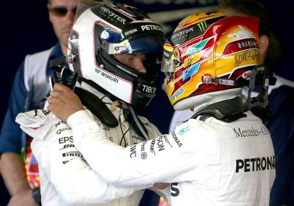 SOCHI, RUSSIA - APRIL 30, 2017: Mercedes AMG Petronas F1 driver Lewis Hamilton (R) of the United Kingdom congratulates his team-mate Valtteri Bottas of Finland on winning the 2017 Formula One Russian Grand Prix at the Sochi Autodrom racing circuit. Alexander Demianchuk TASS  TS04A39F