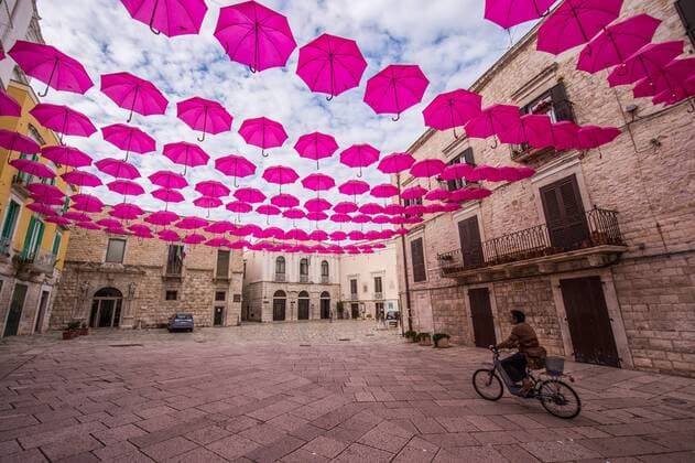 Italy: Molfetta in Rosa On the occasion of the eight stage of the Giro d Italia, which started as Molfetta on May 13th, the city was full of pink not only unmistakable symbols of the city, the Cathedral, the Cathedral of Our Lady of the Martyrs but also a beautiful installation Of two hundred umbrellas open on Piazza Municipio, an unusual and evocative cover to greet the arrival of athletes. While waiting for cyclists, the city is pink, the color symbol of the competition, with the artistic installation La vie en rose under the project Molfetta urban art proposed and coordinated by the Pro Artibus association with the support of Stage committee.  ©xDavidexPischettolax xPacificxPress