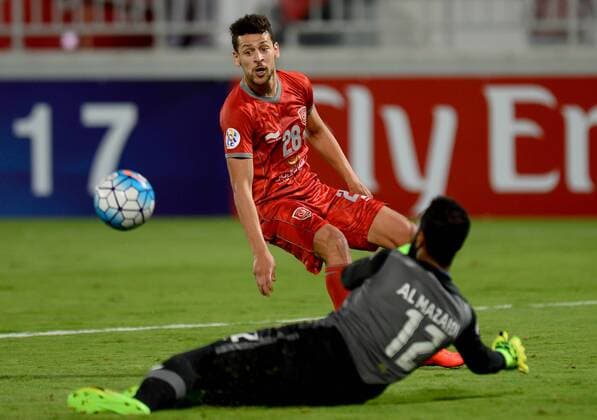(170510) -- DOHA, May 10, 2017 -- Youssef Msakni (L) of Lekhwiya faces Ali Ibrahim Almazaidi, goalie of Al Fateh during the AFC Asian Champions League Group B match between Qatar s Lekhwiya SC and Saudi Arabia s Al Fateh FC at the Abdullah Bin Khalifa Stadium in Doha, capital of Qatar, on May 9, 2017. Lekhwiya won 4-1. ) (SP)QATAR-DOHA-SOCCER-AFC-CHAMPIONS LEAGUE-GOURP B-LEKHWIYA SC VS AL FATEH FC Nikku 