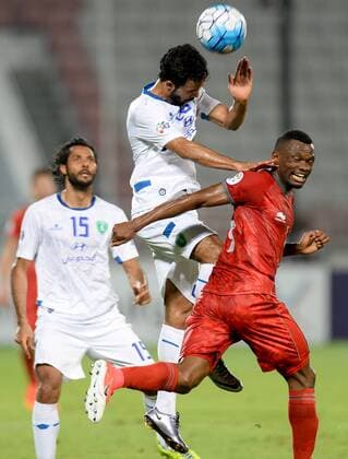 (170510) -- DOHA, May 10, 2017 -- Ali Ahmed Alzaqan (Top) of Al Fateh heads the ball during the AFC Asian Champions League Group B match between Qatar s Lekhwiya SC and Saudi Arabia s Al Fateh FC at the Abdullah Bin Khalifa Stadium in Doha, capital of Qatar, on May 9, 2017. Lekhwiya won 4-1. ) (SP)QATAR-DOHA-SOCCER-AFC-CHAMPIONS LEAGUE-GOURP B-LEKHWIYA SC VS AL FATEH FC Nikku 