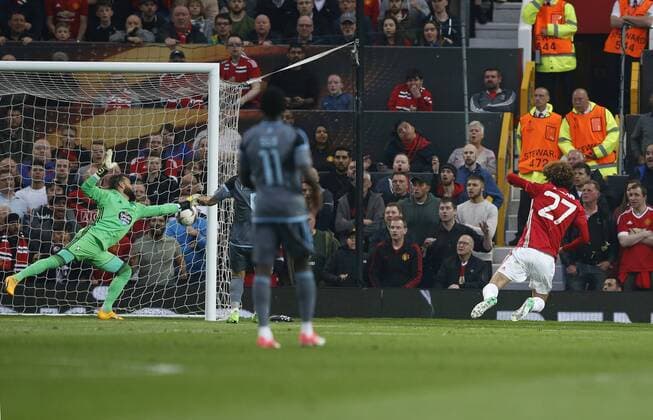 Mauroane Fellaini of Manchester United ManU heads past Sergio Alvarez of Celta Vigo for the first goal during the Europa League Semi Final 2nd Leg match at Old Trafford Stadium, Manchester. Picture date: May 11th 2017. Pic credit should read: Simon Bellis Sportimage EDITORIAL USE ONLY. No use with unauthorised audio, video, data, fixture lists, club league logos or live services. Online in-match use limited to 120 images, no video emulation. No use in betting, games or single club league player publications.