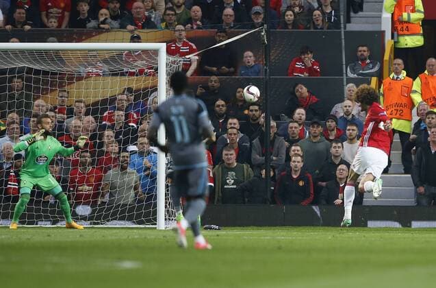 Mauroane Fellaini of Manchester United ManU heads past Sergio Alvarez of Celta Vigo for the first goal during the Europa League Semi Final 2nd Leg match at Old Trafford Stadium, Manchester. Picture date: May 11th 2017. Pic credit should read: Simon Bellis Sportimage EDITORIAL USE ONLY. No use with unauthorised audio, video, data, fixture lists, club league logos or live services. Online in-match use limited to 120 images, no video emulation. No use in betting, games or single club league player publications.