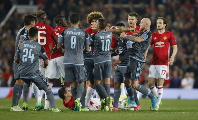 John Guidetti of Celta Vigo goes down following a mass brawl during the Europa League Semi Final 2nd Leg match at Old Trafford Stadium, Manchester. Picture date: May 11th 2017. Pic credit should read: Simon Bellis Sportimage EDITORIAL USE ONLY. No use with unauthorised audio, video, data, fixture lists, club league logos or live services. Online in-match use limited to 120 images, no video emulation. No use in betting, games or single club league player publications.