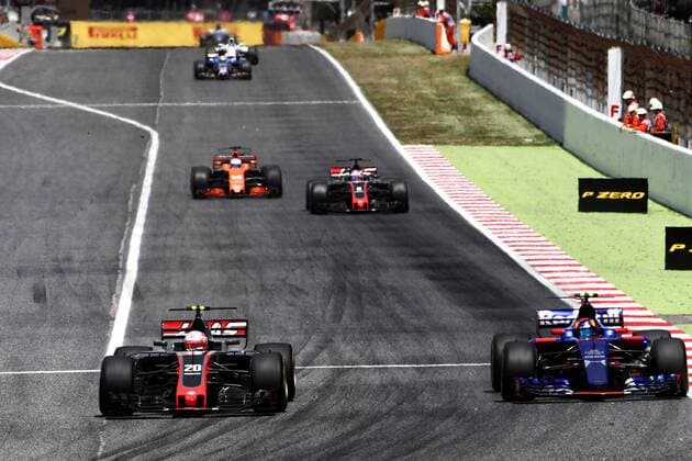 Spanish Grand Prix, Barcelona 11 - 14 May 2017 Kevin Magnussen (DEN) Haas VF-17 and Carlos Sainz Jr (ESP) Scuderia Toro Rosso STR12 battle for position. 14.05.2017. 