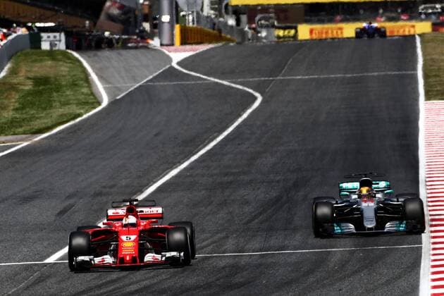 Spanish Grand Prix, Barcelona 11 - 14 May 2017 Sebastian Vettel (GER) Ferrari SF70H and Lewis Hamilton (GBR) Mercedes AMG F1 W08 battle for the lead of the race. 14.05.2017. 