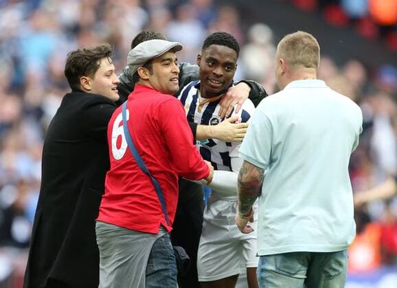 Millwall s fans invade the pitch and mob Mahlon Romeo during the League One Play-Off Final match at Wembley Stadium, London. Picture date: May 20th, 2017. Pic credit should read: David Klein Sportimage EDITORIAL USE ONLY. No use with unauthorised audio, video, data, fixture lists, club league logos or live services. Online in-match use limited to 120 images, no video emulation. No use in betting, games or single club league player publications.