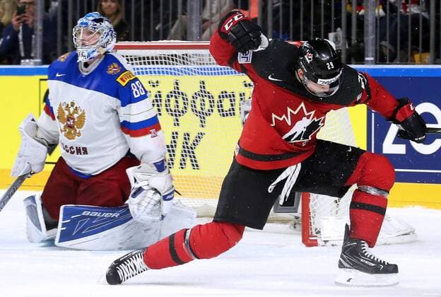 COLOGNE, GERMANY - MAY 20, 2017: Russia s Andrei Vasilevsky (L) concedes a goal to Canada s Nate Mackinnon in their 2017 IIHF Ice hockey Eishockey World Championship WM Weltmeisterschaft semifinal match at Lanxess Arena; Canada won 4-2. Alexander Demianchuk TASS  TS04F72A