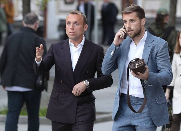 MOSCOW, RUSSIA - MAY 22, 2017: FC Spartak Moscow s Denis Glushakov (L) and Dmitry Kombarov arrive at the Amber Plaza business center to attend an award ceremony to present the Premier Prize for the 2016-17 season. Artyom Korotayev TASS  TS04FE4D