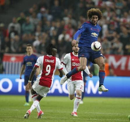 Mauroane Fellaini of Manchester United ManU in action with Bertrand Traore of Ajax during the UEFA Europa League Final match at the Friends Arena, Stockholm. Picture date: May 24th, 2017.Picture credit should read: Matt McNulty Sportimage EDITORIAL USE ONLY. No use with unauthorised audio, video, data, fixture lists, club league logos or live services. Online in-match use limited to 120 images, no video emulation. No use in betting, games or single club league player publications.