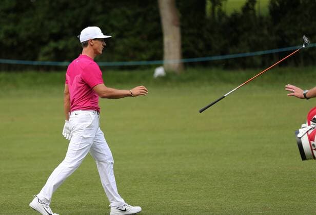 May 25th 2017, Virginia Water, Wentworth, Surrey, England; BMW PGA Golf Herren Championship golf, day 1; Thorbjorn Olesen throws his club to his caddie after a shot on 17th hole xDavidxKissmanx  ActionPlus11883372
