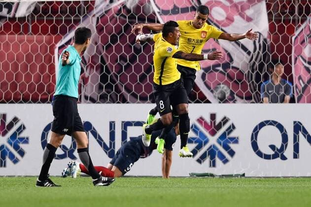Brazilian football player Paulinho of China s Guangzhou Evergrande, front, celebrates with his teammate Alan Carvalho after scoring a goal against Japan s Kashima Antlers before their second Round of 16 match during the 2017 AFC Champions League in Kashima, Japan, 30 May 2017. Kashima Antlers defeats Guangzhou Evergrande in second Round of 16 match at AFC Champions League  20170530_61066