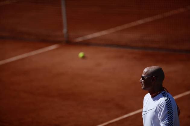 May 31, 2017 - Paris, France - Coach, Andre Agassi watches on during a Novak Djokovic training session prior to his match against Joao Sousa on day four of the 2017 French Open at Roland Garros on May 31, 2017 in Paris, France. 2017 French Open - Day Four  - ZUMAn230 20170531_zaa_n230_113 Copyright: xMehdixTaamallahx