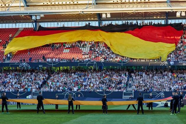 Nuernberg, Germany, 10.06.2017, Laenderspiel, 6. Spieltag - WM-Qualifikation Europa, Deutschland - San Marino, Fans rollen eine riessige Deutschland Fahne ueber den spaerlich gefuellten Raengen aus ( DeFodi049