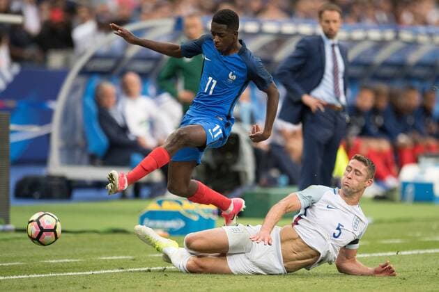 (170614) -- SAINT-DENIS, June 14, 2017 -- Ousmane Dembele (up) of France competes with Gary Cahill (down) of England during the International Friendly Länderspiel match between France and England at the Stade de France in Saint-Denis, France on June 13, 2017. France won England with 3-2. ) (SP)FRANCE-SAINT-DENIS-FOOTBALL-FRIENDLY MATCH-FRANCE VS ENGLAND DavidxNiviere 